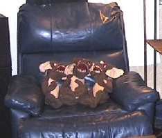 Three Gremlins in the blue leather chair